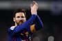 Barcelonas Argentinian forward Lionel Messi celebrates at the end of the Spanish league football match between FC Barcelona and Real Madrid CF at the Camp Nou stadium in Barcelona on May 6, 2018. / AFP PHOTO / Josep LAGO