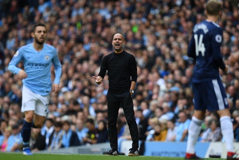  Manchester Citys Spanish manager Pep Guardiola shouts at his players during the English Premier League football match between Manchester City and Fulham at the Etihad Stadium in Manchester, north west England, on September 15, 2018. / AFP PHOTO / Paul ELLIS / RESTRICTED TO EDITORIAL USE. No use with unauthorized audio, video, data, fixture lists, club/league logos or live services. Online in-match use limited to 120 images. An additional 40 images may be used in extra time. No video emulation. Social media in-match use limited to 120 images. An additional 40 images may be used in extra time. No use in betting publications, games or single club/league/player publications. / Editoria: SPOLocal: ManchesterIndexador: PAUL ELLISSecao: soccerFonte: AFPFotógrafo: STF