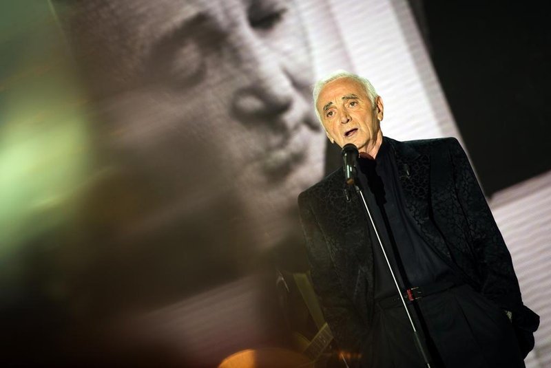 Armenian French singer Charles Aznavour takes part in the recording of the TV broadcast show Vivement Dimanche on August 30, 2011 in the studios of French channel France 2 in Paris. AFP PHOTO / LIONEL BONAVENTURE