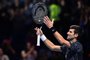 Serbias Novak Djokovic smiles as he celebrates his straight sets win in his mens singles round-robin match against Croatias Marin Cilic on day six of the ATP World Tour Finals tennis tournament at the O2 Arena in London on November 16, 2018. (Photo by Glyn KIRK / AFP)Editoria: SPOLocal: LondonIndexador: GLYN KIRKSecao: tennisFonte: AFPFotógrafo: STR