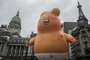 View of a balloon depicting US President Donald Trump outside the Congress building in Buenos Aires on November 29, 2018, as part of the People's Summit. Global leaders gather in the Argentine capital for a two-day G20 summit beginning on Friday likely to be dominated by simmering international tensions over trade.Alberto RAGGIO / AFP