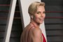 South African actress Charlize Theron poses as she arrives to the 2016 Vanity Fair Oscar P