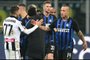 Inter Milan's Belgian midfielder Radja Nainggolan (R) and Udinese's midfielder Marco D'Alessandro tap hands at the end of the Italian Serie A football match Inter Milan vs Udinese on December 15, 2018 at the San Siro stadium in Milan. 