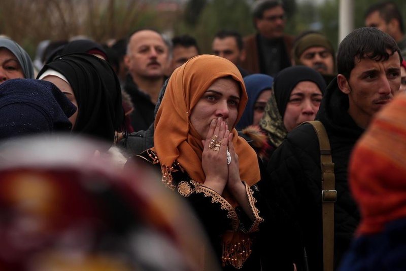 A woman mourns the death of a local official, who Fighters from the Syrian Democratic Forces (SDF) say was assassinated in a Kurdish-held area in the countryside of Deir Ezzor, during his funeral in northeastern Syrian Kurdish-majority city of Qamishli, on December 31, 2018. (Photo by Delil SOULEIMAN / AFP)