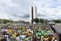  Supporters of Brazilian President-elect Jair Bolsonaro, gather to wait for his inauguration ceremony at Tres Poderes square in front of the Planalto Palace in Brasilia, on January 01, 2019. - Brazil entered a new chapter in its history on Tuesday, embracing a far-right president, Jair Bolsonaro, whose determination to break with decades of centrist rule has raised both hopes and fears. (Photo by EVARISTO SA / AFP)Editoria: POLLocal: BrasíliaIndexador: EVARISTO SASecao: politics (general)Fonte: AFPFotógrafo: STF