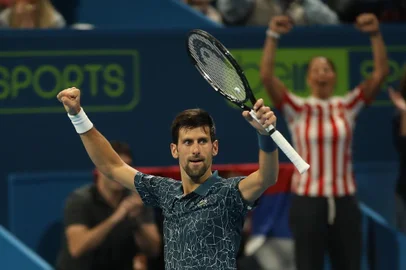 Novak Djokovic of Serbia reacts after defeating Nikoloz Basilashvili of Georgia during their ATP Qatar Open tennis quarter-final match in Doha on January 3, 2019. (Photo by KARIM JAAFAR / AFP)