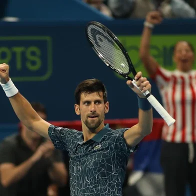 Novak Djokovic of Serbia reacts after defeating Nikoloz Basilashvili of Georgia during their ATP Qatar Open tennis quarter-final match in Doha on January 3, 2019. (Photo by KARIM JAAFAR / AFP)