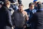  Italian former communist militant Cesare Battisti (L), wanted in Rome for four murders attributed to a far-left group in the 1970s, is escorted by Italian Police officers after stepping off a plane coming from Bolivia and chartered by Italian authorities, after landing at Ciampino airport in Rome on January 14, 2019. - Former communist militant Cesare Battisti landed in Rome on January 14 after an international police squad tracked the Italian down and arrested him in Bolivia, ending almost four decades on the run. (Photo by Alberto PIZZOLI / AFP)Editoria: POLLocal: RomeIndexador: ALBERTO PIZZOLISecao: politics (general)Fonte: AFPFotógrafo: STF