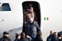  Italian former communist militant Cesare Battisti (Top C), wanted in Rome for four murders attributed to a far-left group in the 1970s, is escorted by Italian Police officers as he steps off a plane coming from Bolivia and chartered by Italian authorities, after landing at Ciampino airport in Rome on January 14, 2019. - Former communist militant Cesare Battisti landed in Rome on January 14 after an international police squad tracked the Italian down and arrested him in Bolivia, ending almost four decades on the run. (Photo by Alberto PIZZOLI / AFP)Editoria: POLLocal: RomeIndexador: ALBERTO PIZZOLISecao: politics (general)Fonte: AFPFotógrafo: STF