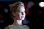 US actress Jennifer Lawrence poses for pictures on the red carpet upon arrival for the wor