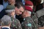 Brazilian Army General Luiz Eduardo Ramos Baptista Pereira (R) speaks to Brazilian President-elect Jair Bolsonaro (C), during the graduation ceremony of new paratroopers at the Parachute Infantry Battalion Vila Militar, in Rio de Janeiro, Brazil, on November 24, 2018. (Photo by Fernando Souza / AFP)