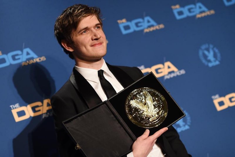 (FILES) In this file photo taken on February 3, 2019 Director Bo Burnham poses with the award for Outstanding Directorial Achievement in First-Time Feature Film for Eight Grade in the press room during the 71st Annual Directors Guild Of America (DGA) Awards at the Ray Dolby Ballroom in Hollywood. - Eighth Grade, a first-time feature about an introverted teens school experience, won surprise top honors at the Writers Guild of America Awards February 17, 2019, a week before Hollywoods award season climaxes with the Oscars.Bo Burnhams comedy-drama took the prize for Original Screenplay, beating out Green Book, Vice and Roma -- whose screenplays are all nominated for Oscars -- as well as A Quiet Place.Burnham was also an upstart winner earlier this month at the Directors Guild of America awards where Eighth Grade won for best first-time feature. (Photo by Valerie MACON / AFP)