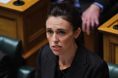 New Zealand Prime Minister Jacinda Ardern speaks during the Parliament session in Wellington on March 19, 2019. - Ardern vowed never to utter the name of the twin-mosque gunman as she opened a sombre session of parliament with an evocative as salaam alaikum message of peace to Muslims. (Photo by David LINTOTT / AFP)