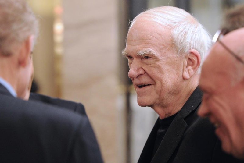 (FILES) In this file photo taken on November 30, 2010 Czech-born writer Milan Kundera (C) attends the 20th anniversary party of the French philosopher Bernard-Henri Levys review La regle du jeu (The rules of the game) in Paris. - On April 1, 2019, writer Milan Kundera, author of The Unbearable Lightness of Being (1984), will celebrate his 90th birthday. (Photo by Miguel MEDINA / AFP)