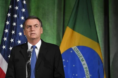 Brazils President Jair Bolsonaro speaks during a discussion on US-Brazil relations at the US Chamber of Commerce in Washington, DC on March 18, 2019. (Photo by MANDEL NGAN / AFP)