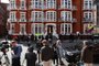 Members of the televsion media prepare to broadcast outside the Embassy of Ecuador in London on April 11, 2019, after British police arrested WikiLeaks founder Julian Assange. - WikiLeaks founder Julian Assanges nearly seven-year hideout in Ecuadors London embassy abruptly ended Thursday when police entered the building and arrested him ahead of possible extradition to the United States. Footage shot by the Russian video news agency Ruptly showed a frantic-looking Assange -- his worn face framed by a large white beard and shock of grey hair -- being huddled out of the building by plain-clothes security officers and pulled into a waiting police van. (Photo by ISABEL INFANTES / AFP)