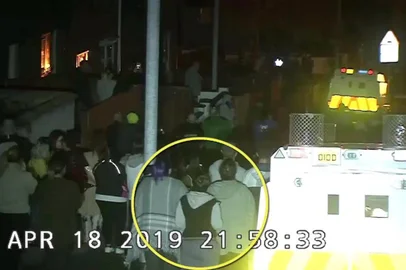 A still image taked from CCTV video footage released by the Police Service of Northern Ireland (PSNI) on April 20, 2019 shows journalist Lyra Mckee (C) highlighted observing violent disorder during which she was shot dead in the Creggan area of Derry (Londonderry) in northern Ireland on the night of April 18, 2019. - Two teenage men have been arrested after the shooting dead of journalist Lyra Mckee in Northern Ireland, police said on April 20. The 18 and 19-year-olds were arrested in Londonderry under anti-terror laws and taken to Belfast for questioning, the Police Service of Northern Ireland said. (Photo by HO / POLICE SERVICE OF NORTHERN IRELAND (PSNI) / AFP) / RESTRICTED TO EDITORIAL USE - MANDATORY CREDIT AFP PHOTO / POLICE SERVICE OF NORTHERN IRELAND  - NO MARKETING NO ADVERTISING CAMPAIGNS - DISTRIBUTED AS A SERVICE TO CLIENTS