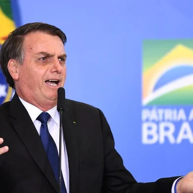Brazilian President Jair Bolsonaro talks during the signing ceremony of the decree that facilitates to own, carry and import weapons, at the Planalto Palace in Brasilia, on May 7, 2019. (Photo by EVARISTO SA / AFP)