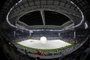 Organizers prepare the pitch for the opening ceremony of the Al Wakrah Stadium (Al Janoub stadium) in the Qatari city of Al Wakrah on May 16, 2019, ahead of the Amir Cup final football match between Al Sadd and Al Duhail. - The 40,000-seater stadium was designed by the late Zaha Hadid and took it's inspiration from the sails of traditional dhow boats. (Photo by Karim JAAFAR / AFP) Catar