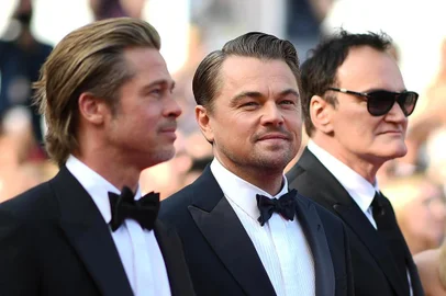 (FromL) US actor Brad Pitt, US actor Leonardo DiCaprio, US film director, screenwriter, producer, and actor Quentin Tarantino and Australian actress Margot Robbie arrive for the screening of the film Once Upon a Time... in Hollywood at the 72nd edition of the Cannes Film Festival in Cannes, southern France, on May 21, 2019. (Photo by LOIC VENANCE / AFP)