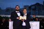 Brazilian director Juliano Dornelles (L) and Brazilian film director Kleber Mendonca Filho pose during a photocall after they shared the Jury Prize for their film Bacurau on May 25, 2019 during the closing ceremony of the 72nd edition of the Cannes Film Festival in Cannes, southern France. (Photo by LOIC VENANCE / AFP)
