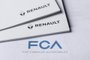 (FILES) In this file photo taken on May 27, 2019 shows the logos of Italian-US carmaker Fiat Chrysler Automobiles (FCA) and French auto maker Renault. - Carmaker Fiat Chrysler withdrew an offer to merge with Renault on June 5, 2019, after the French auto company postponed its decision on the project, two sources close to the negotiations told AFP. (Photo by MARCO BERTORELLO / AFP)