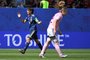 Japan's defender Saki Kumagai (L) celebrates at the end ofg the France 2019 Women's World Cup Group D football match between Japan and Scotland, on June 14, 2019, at the Roazhon Park stadium in Rennes, western France. 