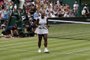 US player Serena Williams celebrates beating US player Alison Riske during their womens singles quarter-final match on day eight of the 2019 Wimbledon Championships at The All England Lawn Tennis Club in Wimbledon, southwest London, on July 9, 2019. (Photo by Adrian DENNIS / AFP) / RESTRICTED TO EDITORIAL USE