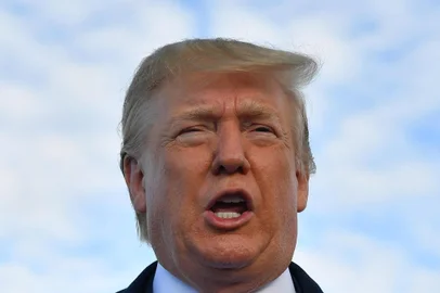 (FILES) In this file photo taken on June 5, 2019 US President Donald Trump speaks before boarding Air Force One at Shannon Airport in Shannon, Ireland, and fly to Normandy, France, to attend the 75th D-Day Anniversary. - US President Donald Trump said late on June 7, 2019 that Washington had reached an agreement with Mexico on migration, and that the punishing tariffs he had been threatening were indefinitely suspended. (Photo by MANDEL NGAN / AFP)