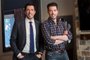 Hosts Drew (L) and Jonathan (R) Scott pose in the new living room of homeowners Katie and Justins recently renovated Toronto home, as seen on Property Brothers.