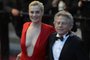 French director Roman Polanski (R) and his wife actress Emmanuelle Seigner leave on May 25, 2013 after attending the screening of the film Venus in Fur presented in Competition at the 66th edition of the Cannes Film Festival in Cannes. Cannes, one of the worlds top film festivals, opened on May 15 and will climax on May 26 with awards selected by a jury headed this year by Hollywood legend Steven Spielberg.      AFP PHOTO / ANNE-CHRISTINE POUJOULAT