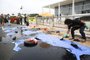 A Greenpeace activist spills fake oil during a protest in front of Planalto Palace in Brasilia, Brazil, Wednesday, October 23, 2019. - Greenpeace denounced what they call government negligence due to large blobs of oil staining more than 130 beaches in northeastern Brazil began appearing in early September and have now turned up along a 2,000km stretch of the Atlantic coastline. The source of the patches remain a mystery despite President Jair Bolsonaros assertions they came from outside the country and were possibly the work of criminals.