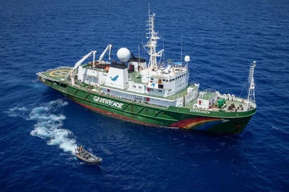 The MY Esperanza and a Greenpeace inflatable bear witness to an illegal fishing vessel.  Greenpeace is in the Indian Ocean to document and peacefully tackle unsustainable fishing.