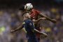 Argentina's Boca Juniors defender Julio Buffarini (front) vies for the ball with Brazil's Athletico Paranaense forward Rony during their Copa Libertadores 2019 group G football match at the "Bombonera" stadium in Buenos Aires, Argentina, on May 9, 2019. (Photo by JUAN MABROMATA / AFP)