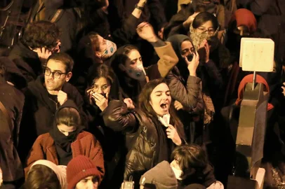 Iranians students chant slogans as they demonstrate following a tribute for the victims of Ukraine International Airlines Boeing 737 in front of the Amirkabir University in the capital Tehran, on January 11, 2020. - Iranian police dispersed students chanting radical slogans during a gathering in Tehran to honour the 176 people killed when an airliner was mistakenly shot down, Fars news agency reported. AFP correspondents said hundreds of students had gathered early in the evening at Amir Kabir University, in downtown Tehran, to pay respects to those killed in the air disaster. (Photo by ATTA KENARE / AFP)<!-- NICAID(14384523) -->
