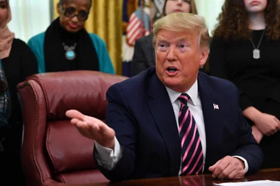 US President Donald Trump gestures as he speaks during the Announcement of the Guidance on Constitutional Prayer in Public Schools, at the White House in Washington, DC, on January 16, 2020. (Photo by Nicholas Kamm / AFP)<!-- NICAID(14389699) -->