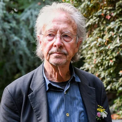 Austrian writer Peter Handke poses in Chaville, in the Paris surburbs, on October 10, 2019 after he was awarded with the 2019 Nobel Literature Prize. - Austrian Peter Handke, one of the most original German-language writers alive, who once used his famously sharp tongue to call for the Nobel Prize in Literature to be abolished, was awarded with the 2019 Nobel Literature Prize on October 10. The prize brings its winner false canonisation along with one moment of attention (and) six pages in the newspaper, the novelist, playwright, poet and translator told Austrian media in 2014. (Photo by Alain JOCARD / AFP)<!-- NICAID(14284452) -->