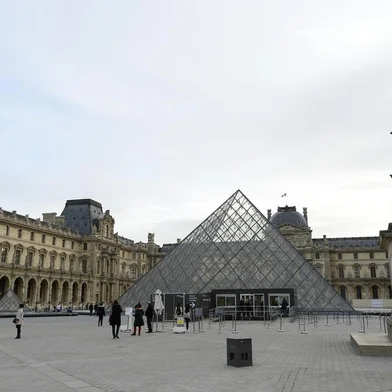 The area around the Louvre Pyramid at the Louvre museum in Paris stands largely deserted on November in Paris on November 14, 2015, following a series of coordinated attacks in and around Paris late Friday which left more than 120 people dead.  Schools, markets, museums and major tourist sites in the Paris area were closed on Saturday and sporting fixtures were cancelled following the terror attacks on the French capital, local authorities said.. AFP PHOTO / BERTRAND GUAY<!-- NICAID(11821615) -->