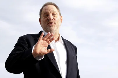 (FILES) This file photo taken on October 5, 2015 shows Harvey Weinstein, US film producer and executive producer of the TV series War and Peace, posing during a photocall at the MIPCOM audiovisual trade fair in Cannes, southeastern France.New York police said on October 12, 2017 they have reopened a investigation into allegations of a 2004 sexual assault by disgraced movie mogul Harvey Weinstein. An avalanche of claims of sexual harassment, assault and rape by the Hollywood heavyweight have surfaced since the publication last week of an explosive New York Times report alleging a history of abusive behavior dating back decades. / AFP PHOTO / VALERY HACHE