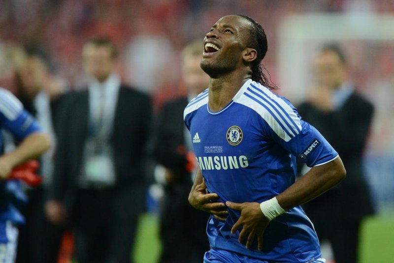Chelseas Ivorian forward Didier Drogba celebrates after scoring a goal during the UEFA Champions League final football match between FC Bayern Muenchen and Chelsea FC on May 19, 2012 at the Fussball Arena stadium in Munich.. AFP PHOTO / ADRIAN DENNIS (Photo by ADRIAN DENNIS / AFP)<!-- NICAID(13842464) -->