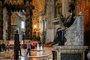 A general view shows St. Peters Baldachin (L) and St. Peters statue (R) while people and nuns visit St. Peters Basilica as it reopens on May 18, 2020 in The Vatican during the lockdown aimed at curbing the spread of the COVID-19 infection, caused by the novel coronavirus. - Saint Peters Basilica throws its doors open to visitors on May 18, 2020, marking a relative return to normality at the Vatican and beyond in Italy, where most business activity is set to resume. (Photo by Vincenzo PINTO / AFP)<!-- NICAID(14502110) -->