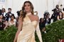 Gisele Bundchen arrives for the 2018 Met Gala on May 7, 2018, at the Metropolitan Museum of Art in New York.The Gala raises money for the Metropolitan Museum of Arts Costume Institute. The Galas 2018 theme is Heavenly Bodies: Fashion and the Catholic Imagination. / AFP PHOTO / <!-- NICAID(13538620) -->