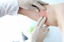 Male doctor in white protective gloves examing patientMale doctor in white latex gloves examines patient with skin disease against office background. Allergy treatment conceptFonte: 299235713<!-- NICAID(14505000) -->