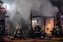  Picture released by Agencia Telam showing firefighters putting out a fire after two explosions at a perfume store killed two firemen and injured 15 others, in Buenos Aires, on June 2, 2020. - Two firefighters died and 15 others suffered injuries from two explosions at the time they were fighting a fire in the perfume store in Buenos Aires, sources from the emergency service reported. (Photo by FERNANDO GENS / TELAM / AFP) / Argentina OUT / RESTRICTED TO EDITORIAL USE - MANDATORY CREDIT AFP PHOTO/ TELAM / FERNANDO GENS - NO MARKETING NO ADVERTISING CAMPAIGNS - DISTRIBUTED AS A SERVICE TO CLIENTSEditoria: DISLocal: Buenos AiresIndexador: FERNANDO GENSSecao: fireFonte: TELAMFotógrafo: STR<!-- NICAID(14513986) -->