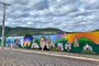 Grafite feito pelo artista urbano caxiense Rafael Ferreira, o APA, retrata a história dos 61 anos da cidade de Muçum. O grafite é um dos maiores do Rio Grande do Sul.<!-- NICAID(14524475) -->