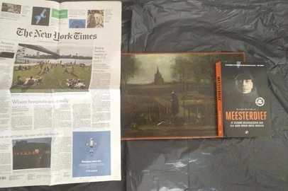 This handout photograph released by Arthur Brand on June 18, 2020, taken on an unknown date and at an undisclosed location, shows a detail on the rear of the 1884 painting by Vincent van Gogh called Parsonage Garden at Nuenen in Spring, stolen from the Singer Laren Museum near Amsterdam on March 30, 2020. - A Dutch art detective said June 18, 2020, that he has received two proof of life photographs of a Vincent Van Gogh painting that was stolen from a museum during the coronavirus lockdown. The 1884 painting, Parsonage Garden at Nuenen in Spring, was snatched in a daring heist when burglars broke into the Singer Laren Museum near Amsterdam on March 30. Arthur Brand, dubbed the Indiana Jones of the Art World for tracing a series of high-profile lost artworks, said he was handed the photos a few days ago by a source he declined to identify. (Photo by - / ARTHUR BRAND / AFP) / RESTRICTED TO EDITORIAL USE - MANDATORY MENTION OF THE ARTIST UPON PUBLICATION - MANDATORY CREDIT AFP PHOTO /COURTESY OF ARTHUR BRAND -  TO ILLUSTRATE THE EVENT AS SPECIFIED IN THE CAPTION - NO MARKETING NO ADVERTISING CAMPAIGNS - DISTRIBUTED AS A SERVICE TO CLIENTS - /