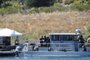 Law enforcement officials gather at the boating dock of Lake Piru in the Los Padres National Forest, Ventura County, California on July 10, 2020, as the search continues for actress Naya Rivera, who was reported missing after going boating with her son on July 8. - "Glee" star Rivera is missing and feared drowned at Lake Piru where patrol boats and helicopters resumed their search for the US actress. (Photo by Robyn Beck / AFP)<!-- NICAID(14543629) -->