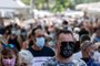 Pedestrians wear face masks as they walk in a congested street market of Lourges, southern France on August 18, 2020. (Photo by Christophe SIMON / AFP)<!-- NICAID(14570715) -->
