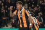  Hull Citys Uruguayan striker Abel Hernandez (C) celebrates scoring his teams first goal during the English Premier League football match between Hull City and Middlesbrough at the KCOM Stadium in Kingston upon Hull, north east England on April 5, 2017. (Photo by Lindsey PARNABY / AFP) / RESTRICTED TO EDITORIAL USE. No use with unauthorized audio, video, data, fixture lists, club/league logos or live services. Online in-match use limited to 75 images, no video emulation. No use in betting, games or single club/league/player publications. / Editoria: SPOLocal: Kingston upon HullIndexador: LINDSEY PARNABYSecao: soccerFonte: AFPFotógrafo: STR<!-- NICAID(14577278) -->
