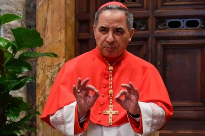 (FILES) In this file photo taken on June 28, 2018 Newly elevated cardinal, Giovanni Angelo Becciu from Italy, attends the courtesy visit of relatives following a consistory for the creation of new cardinals on June 28, 2018 in the Apostolic Palace at St Peter's basilica in Vatican. - Cardinal Angelo Becciu, the head of the vatican's saint-making office, resigned, the Vatican said in a statement on September 24, 2020. Becciu was reportedly indirectly implicated in a financial scandal involving the Vaticans investment in a London real estate deal. (Photo by ANDREAS SOLARO / AFP)<!-- NICAID(14600876) -->